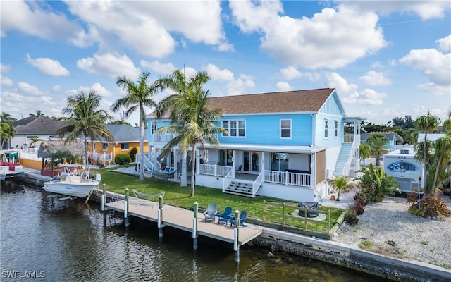 back of property with a water view