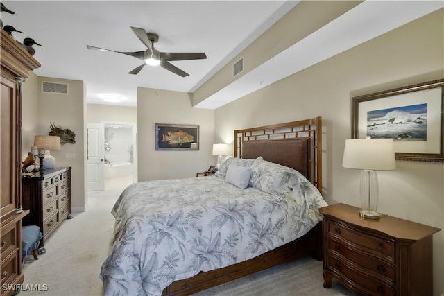 carpeted bedroom with connected bathroom and ceiling fan