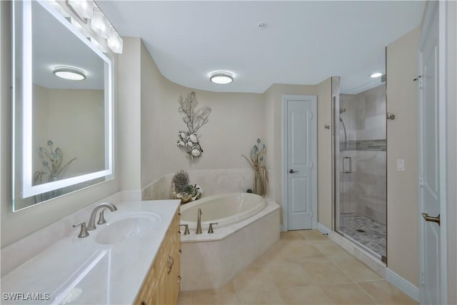 bathroom with plus walk in shower, vanity, and tile patterned floors