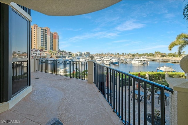 balcony featuring a water view