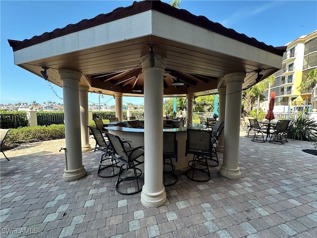 view of patio with a gazebo and a bar