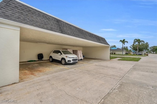 view of vehicle parking with a carport