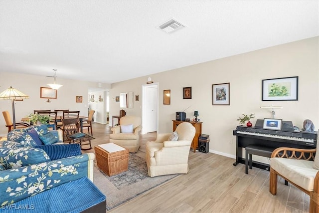 living room with light hardwood / wood-style flooring