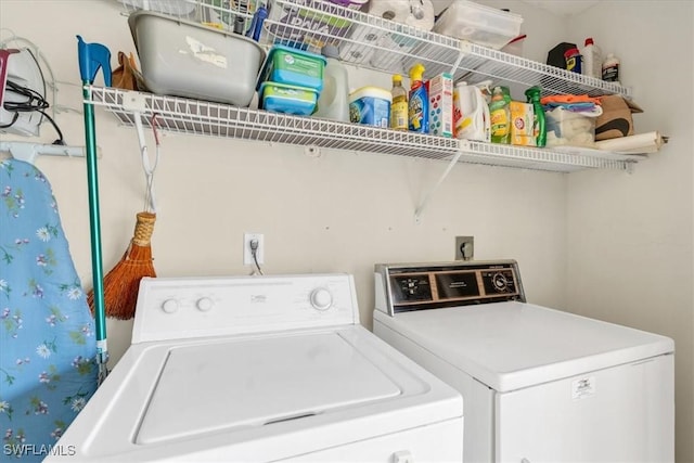 washroom featuring independent washer and dryer