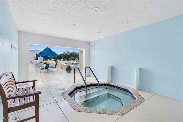 view of pool featuring an indoor hot tub