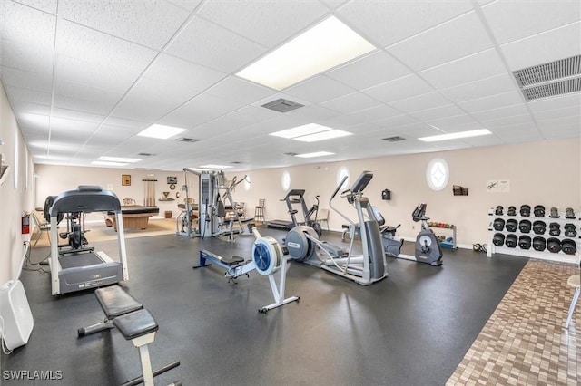 workout area featuring a drop ceiling