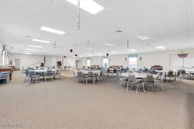 dining space featuring carpet