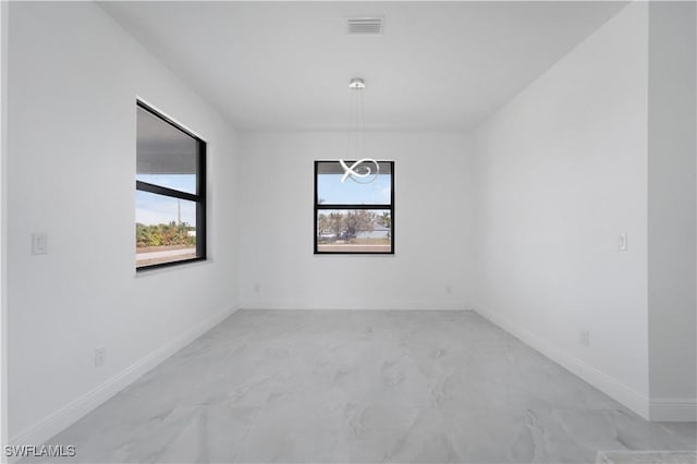 spare room featuring plenty of natural light