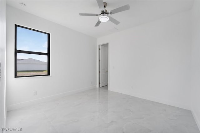 spare room with ceiling fan