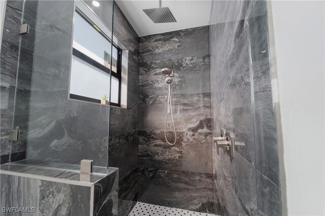 bathroom featuring a tile shower