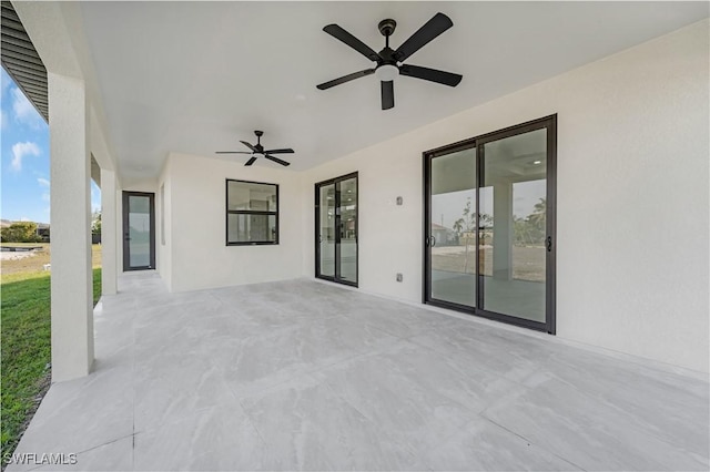 view of patio featuring ceiling fan