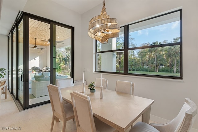 tiled dining room featuring a notable chandelier