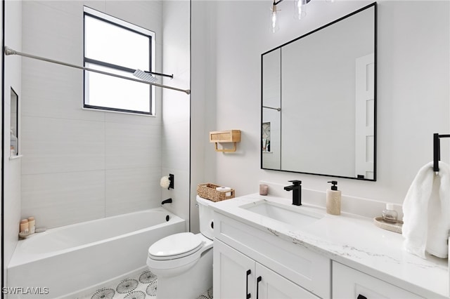 full bathroom featuring tiled shower / bath combo, vanity, and toilet