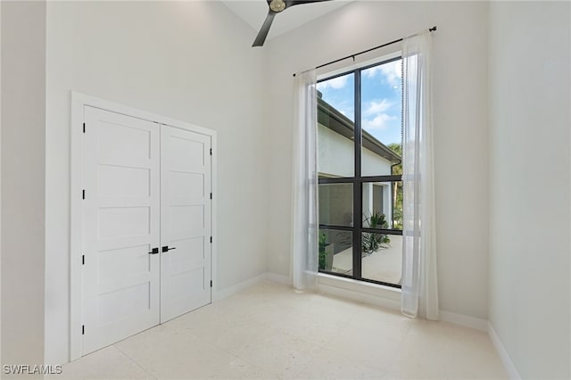 unfurnished bedroom with a closet and ceiling fan