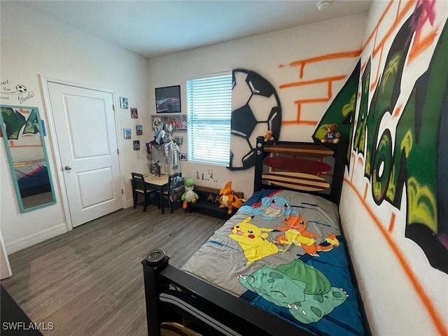 bedroom with hardwood / wood-style floors