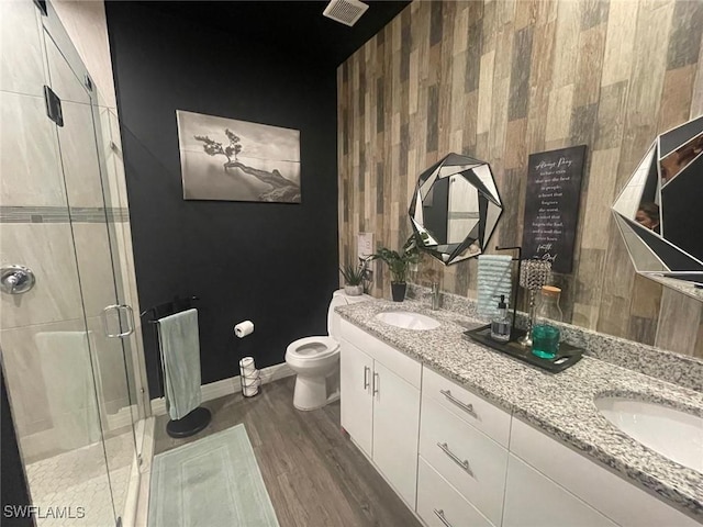 bathroom with vanity, an enclosed shower, hardwood / wood-style floors, and toilet