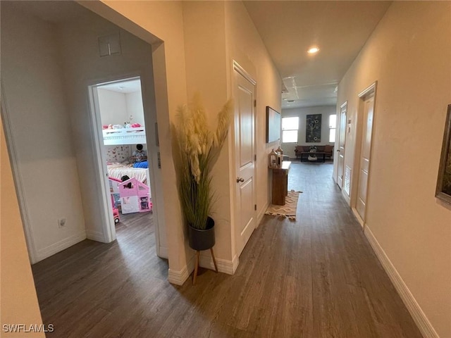 hall with dark hardwood / wood-style flooring