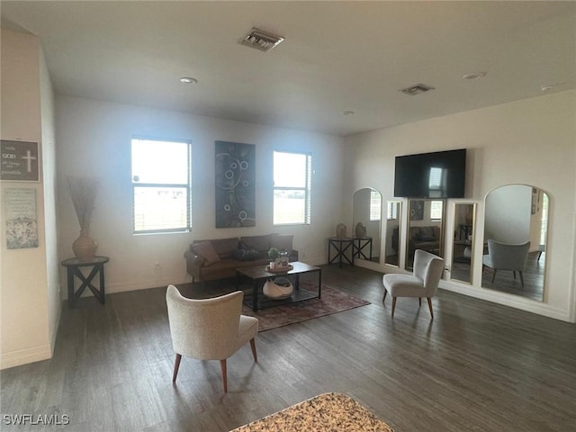 living room featuring dark wood-type flooring