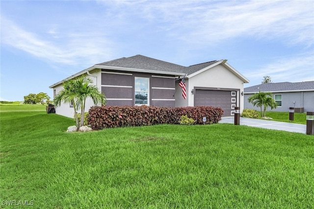 ranch-style home featuring a garage, concrete driveway, a front yard, roof with shingles, and stucco siding