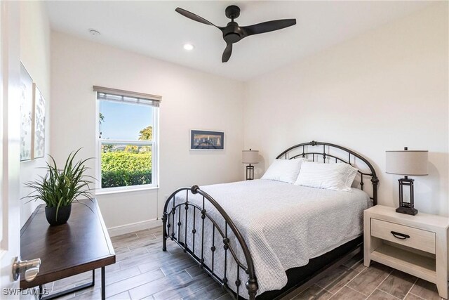 bedroom featuring wood finish floors, recessed lighting, a ceiling fan, and baseboards