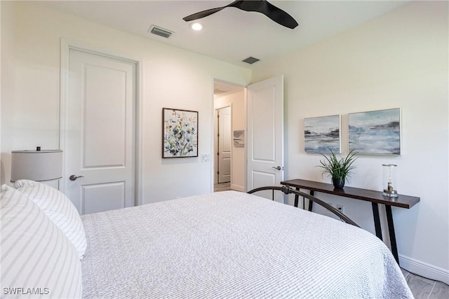 bedroom featuring ceiling fan, a closet, and light wood-type flooring