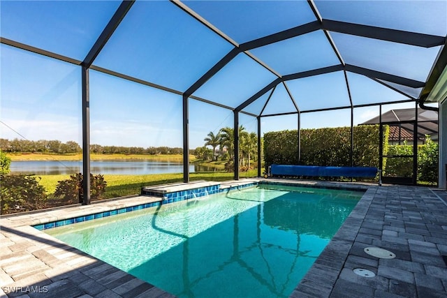 view of pool with a water view, a patio area, and a lanai