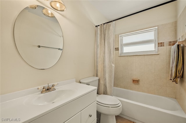 full bathroom featuring vanity, shower / tub combo, and toilet