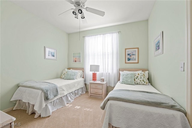 bedroom featuring light carpet and ceiling fan