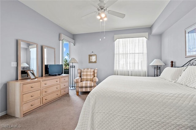 bedroom with light colored carpet and ceiling fan