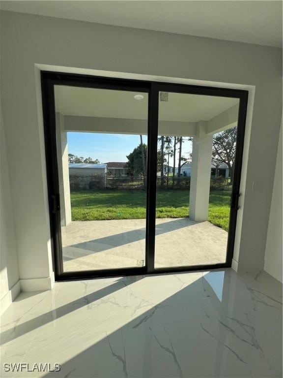 doorway featuring marble finish floor