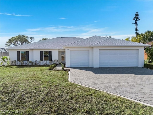 ranch-style house with a garage and a front yard