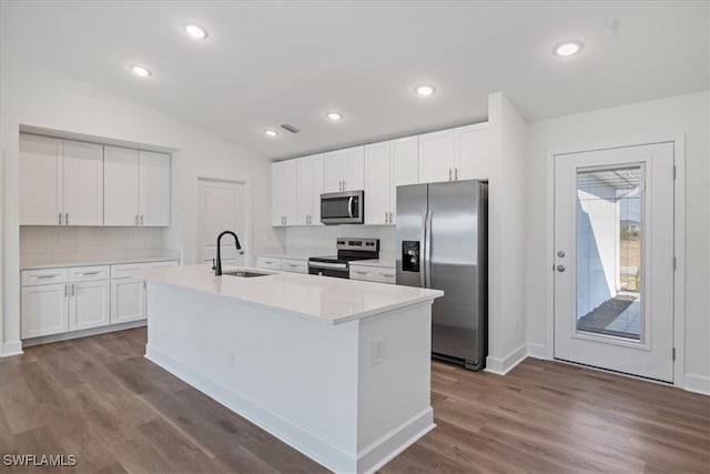 kitchen with white cabinetry, sink, a kitchen island with sink, and stainless steel appliances