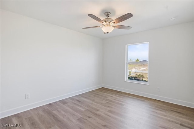 spare room with ceiling fan and light hardwood / wood-style flooring