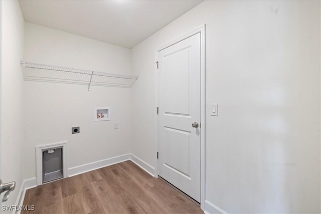 laundry room with washer hookup, light hardwood / wood-style floors, and electric dryer hookup