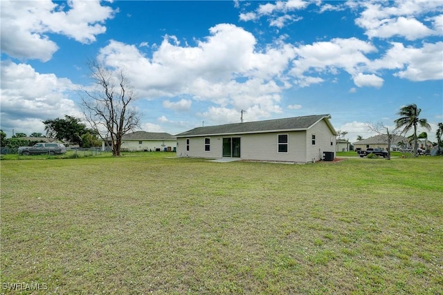 back of property featuring a yard and a patio area