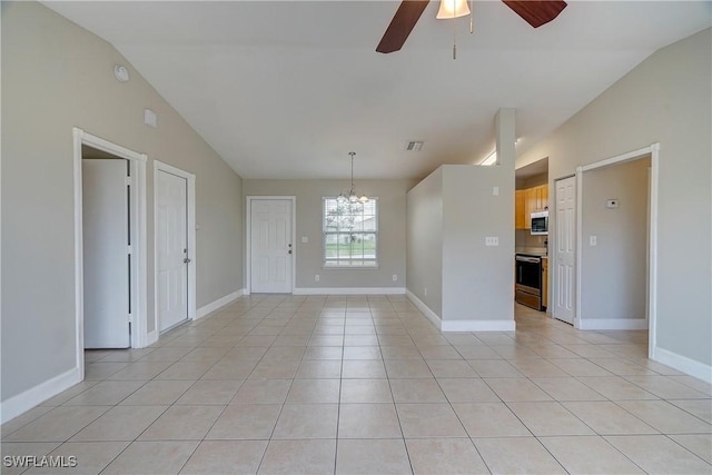 tiled spare room with lofted ceiling and ceiling fan with notable chandelier