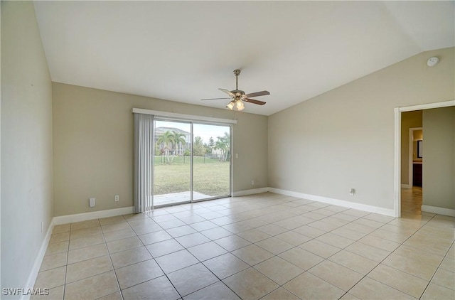 tiled empty room with lofted ceiling and ceiling fan