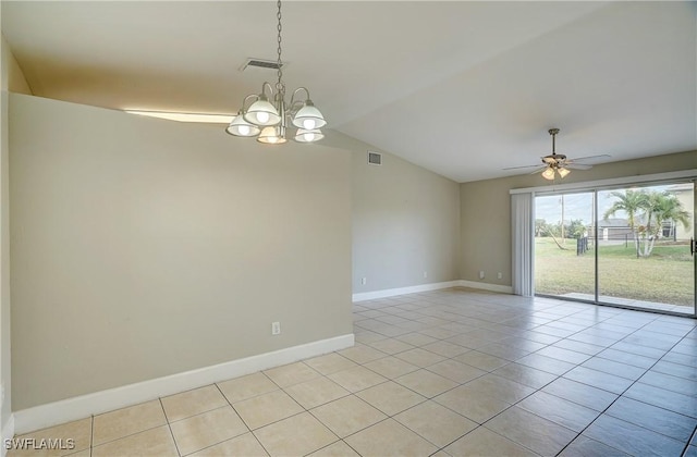 unfurnished room with ceiling fan with notable chandelier, lofted ceiling, and light tile patterned floors