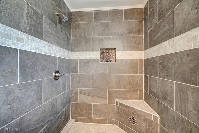 bathroom with tiled shower