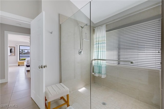 bathroom featuring a shower with door and tile patterned floors