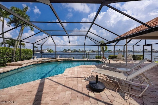 view of swimming pool featuring a lanai, a patio, a water view, and a jacuzzi