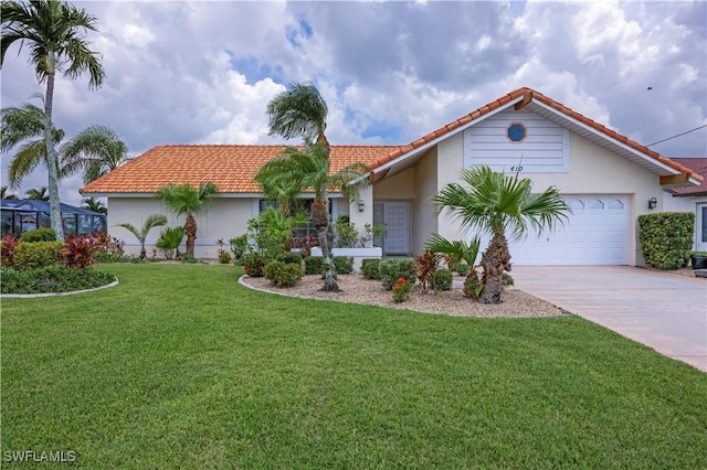 view of front of home featuring a garage and a front yard