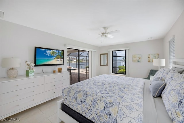 bedroom featuring ceiling fan, access to exterior, and light tile patterned floors