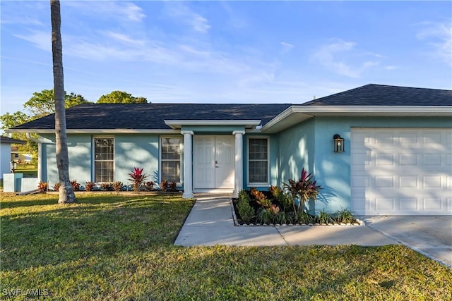 ranch-style home with a garage and a front yard