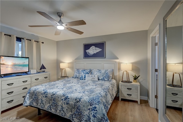 bedroom featuring ceiling fan and light wood-type flooring