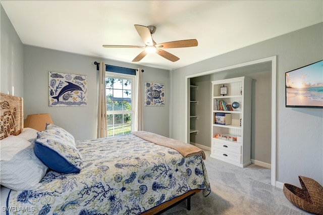 bedroom with light carpet and ceiling fan