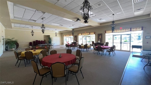 dining area with a paneled ceiling