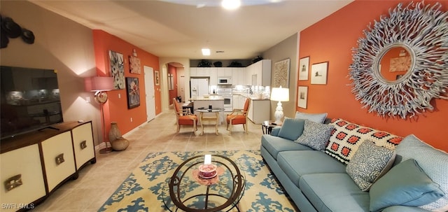 living room featuring light tile patterned floors