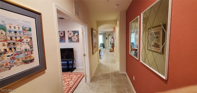 hallway with light tile patterned flooring