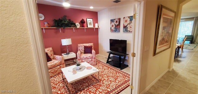 living area with tile patterned flooring